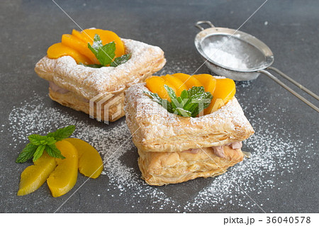 Puff pastry cookies with chocolate cream, apricots 36040578