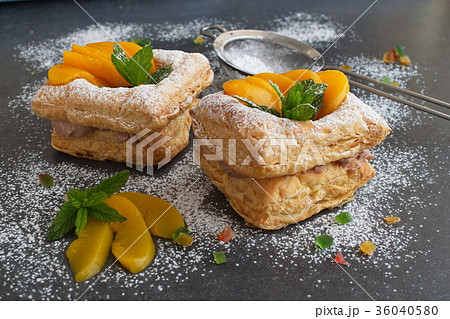 Puff pastry cookies with chocolate cream, apricots 36040580