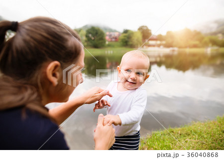 Little boy with his mother making first steps. 36040868