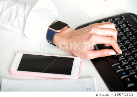 hands  typing on  laptop's keyboard. 36041318
