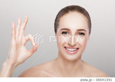 young woman showing gesture Ok 36041391