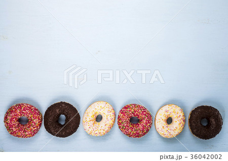 Multicolored donuts close-up 36042002