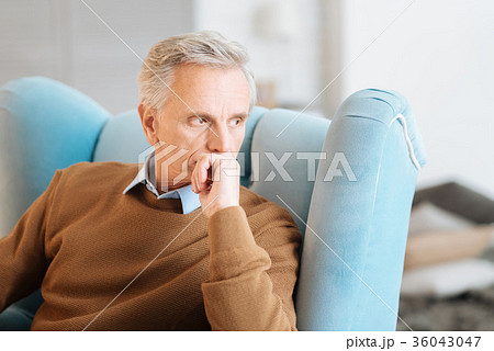 Pensive retired man recalling his memories 36043047