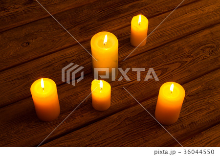 Candles on old wooden background. Candles on old wooden background. 36044550