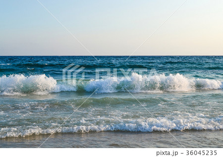 View of the sea. The wave hits the sandy beach. View of the sea. The wave hits the sandy beach. 36045235