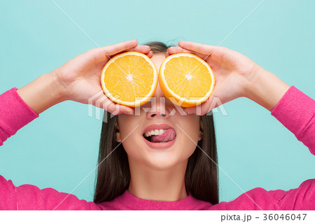 Beautiful woman's face with juicy orange 36046047