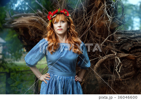 Woman with wreath on his head in the fairy forest. Woman with wreath on his head in the fairy forest. 36046600