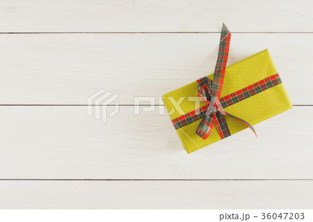 Xmas gift box on white wood table. Top view with 36047203