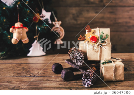 Christmas Gifts with Boxes on Wooden Background Christmas Gifts with Boxes on Wooden Background 36047300