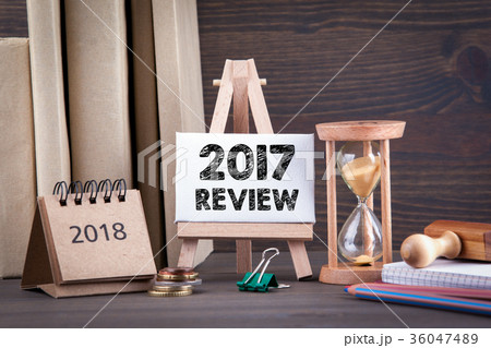 2017 review. Sandglass, hourglass or egg timer on wooden table 2017 review. Sandglass, hourglass or egg timer on wooden table 36047489