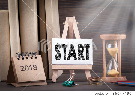 2018 start. Sandglass, hourglass or egg timer on wooden table 36047490