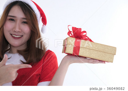 portrait of asian woman in santa claus dress on white background. girl with gift present box. christmas holiday. merry xmas celebration. 36049082