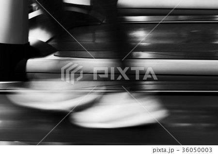 young woman execute exercise in fitness center. female athlete walking on treadmill in gym. sporty girl working out in health club. motion blur image young woman execute exercise in fitness center. female athlete walking on treadmill in gym. sporty girl working out in health club. motion blur image 36050003