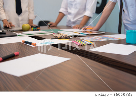 interior designer working with graphic tablet at workplace. artist discussing design and idea at office. business people brainstorming for new creativity project. teamwork, partnership interior designer working with graphic tablet at workplace. artist discussing design and idea at office. business people brainstorming for new creativity project. teamwork, partnership 36050735