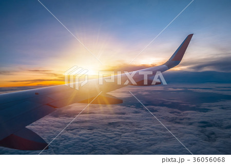 Amazing sunrise view from the window on airplane. Amazing sunrise view from the window on airplane. 36056068