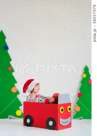 Happy child on Christmas eve Happy child on Christmas eve 36057979