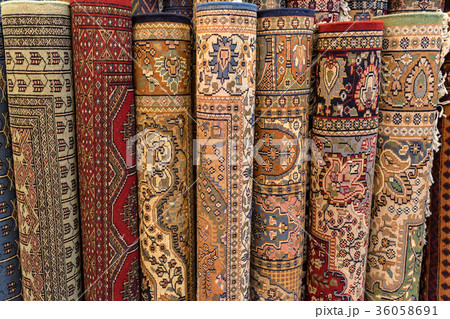 Colorful rolled carpets in oriental marketplace 36058691