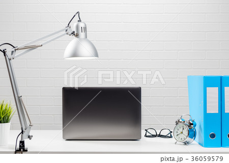 Open laptop on a white desktop in the office 36059579