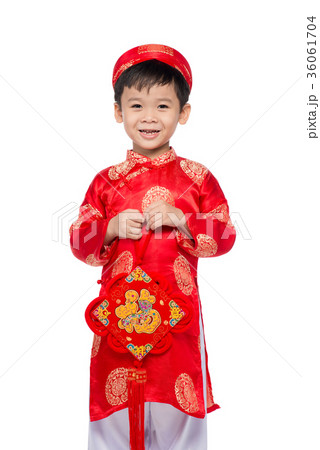 Vietnamese boy cuddling stuffed carp 36061704