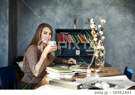 Beautiful Happy Smiling Young Designer Woman sitting at Home Off Beautiful Happy Smiling Young Designer Woman sitting at Home Off 36062891