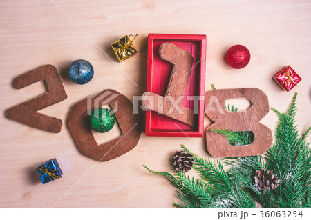 Wooden numbers 2018 with Christmas decoration Wooden numbers 2018 with Christmas decoration 36063254