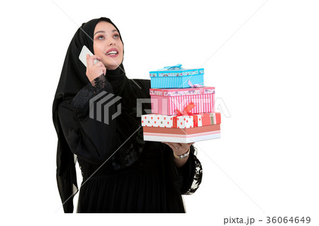 Happy young muslim woman with shopping bag and Happy young muslim woman with shopping bag and 36064649