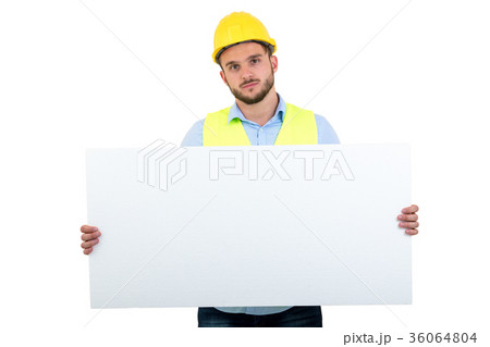 Happy male engineer holding an advertisement blank 36064804