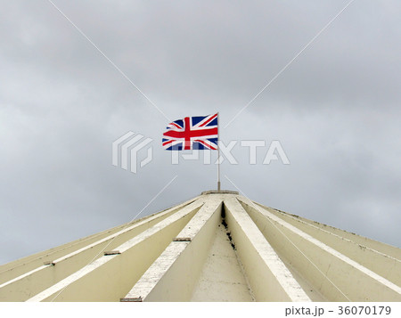 Flag of england floating on a building roof Flag of england floating on a building roof 36070179