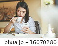 Young woman using smartphone. 36070280