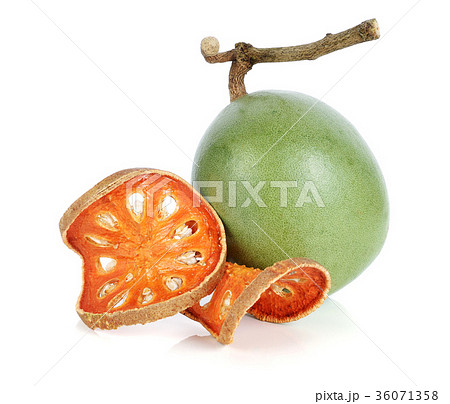 Aegle marmelos and Dry bael fruit on white Aegle marmelos and Dry bael fruit on white 36071358
