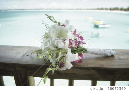 Bridal bouquet and beach view at the background Bridal bouquet and beach view at the background 36071549