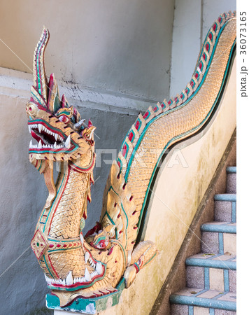 Old dragon statue in the traditional Thai style. Old dragon statue in the traditional Thai style. 36073165