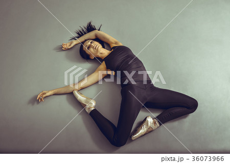 Young woman ballerina lying on the floor without Young woman ballerina lying on the floor without 36073966