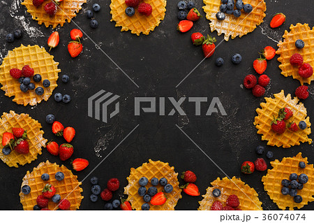 Round belgium waffles with berries Round belgium waffles with berries 36074074