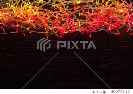 Christmas lights border on dark background 36074119
