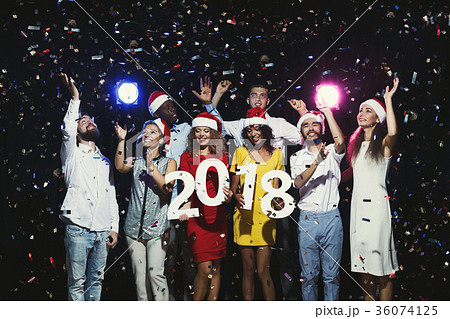 Young multiethnic people with wooden numbers 2018 Young multiethnic people with wooden numbers 2018 36074125