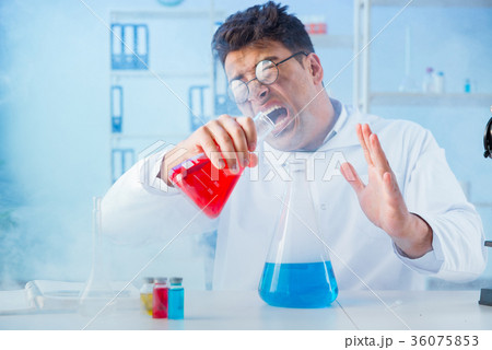 Funny mad chemist working in a laboratory Funny mad chemist working in a laboratory 36075853