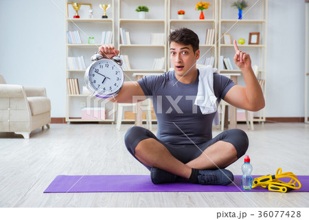 Young man exercising at home in sports and healthy 36077428