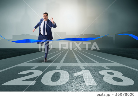 Businessman running towards new year 2018 Businessman running towards new year 2018 36078000