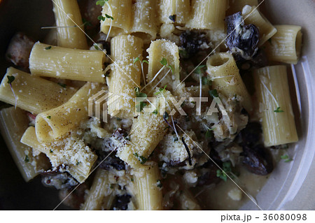 pasta mushroom truffle oil on wood background , Rigatoni pasta noodle with truffle oil mushroom and cheese , Italian food 36080098