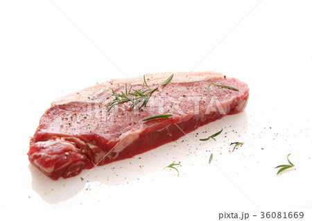 Fresh raw beef steak with pepper and rosemary isolated in white background 36081669