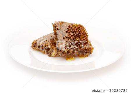 taste honey on the white plate. food ingradient. taste honey on the white plate. food ingradient. 36086725