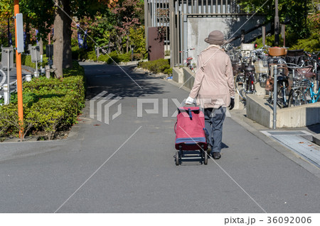 Woman with travel suitcase or luggage walking Woman with travel suitcase or luggage walking 36092006