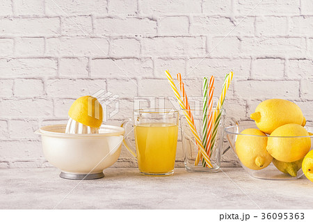 Lemons and juicer for making lemon juice. 36095363