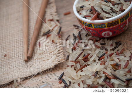 rice grain and chinese chopsticks rice grain and chinese chopsticks 36096024