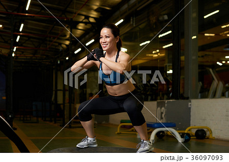 Squatting girl 36097093