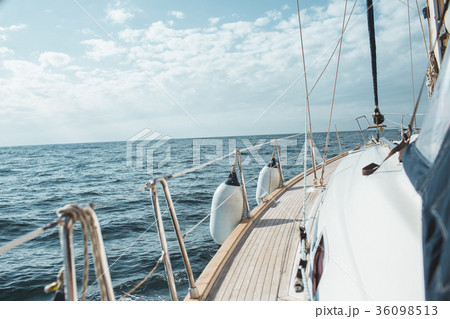 Closeup on women's feet in socks on the yacht 36098513