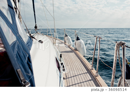 Closeup on women's feet in socks on the yacht 36098514