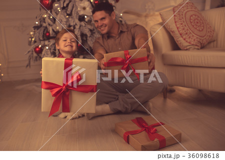 Father with son at home on Christmas evening 36098618