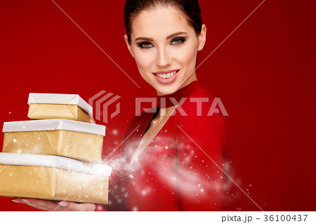 Woman with christmas box gift 36100437